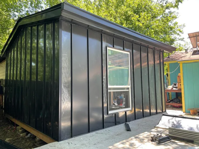 Black standing seam metal wall panels for Roof Inspection in Springdale